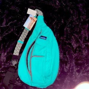 Kavu sling bag. New With Tags. Mint color